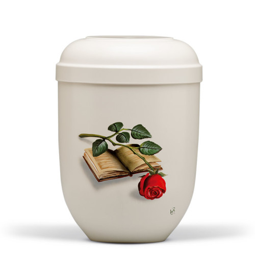 Cremeweiße Naturstoffurne mit handbemaltem Motiv eines Buches und einer Rose, Gesamtansicht mit runder Form und einem geschlossenen Deckel.