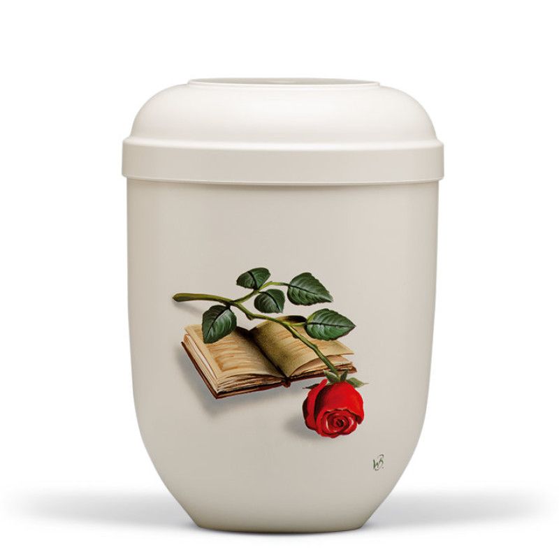 Cremeweiße Naturstoffurne mit handbemaltem Motiv eines Buches und einer Rose, Gesamtansicht mit runder Form und einem geschlossenen Deckel.