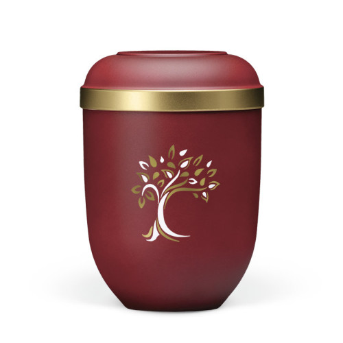 Naturstoffurne in weinrot mit Velours-Oberfläche, goldfarbener Rand und gold-weißer Baum-Dekoration, Gesamtansicht.