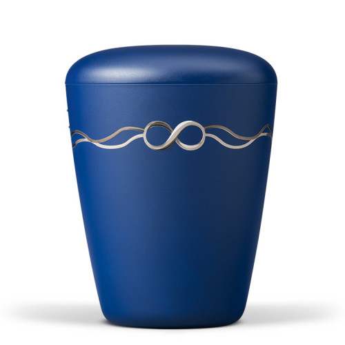 Naturstoffurne in saphirblauem Velours mit einem dekorativen Band in Form des Unendlichkeitssymbols, Gesamtansicht.