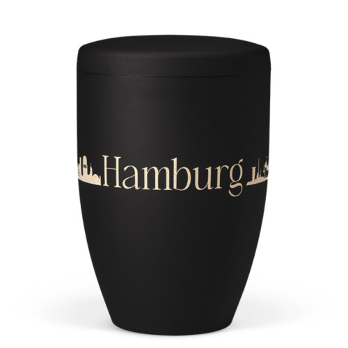 Naturstoffurne in anthrazitfarbenem Velours mit Lasergravur der Silhouette von Hamburg, in konischer Form und mit passendem Deckel.