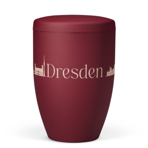 Naturstoffurne in weinrot mit mattem Velours-Finish und Lasergravur der Skyline von Dresden sowie dem Schriftzug "Dresden", Gesamtansicht.