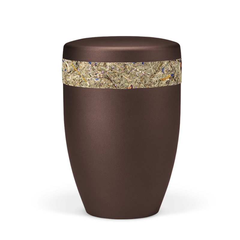 Die Urne ist kastanienbraun-matt und hat einen oberen Rand mit bunten Blüten, besteht aus einem glatten Material und hat eine ovale Form.