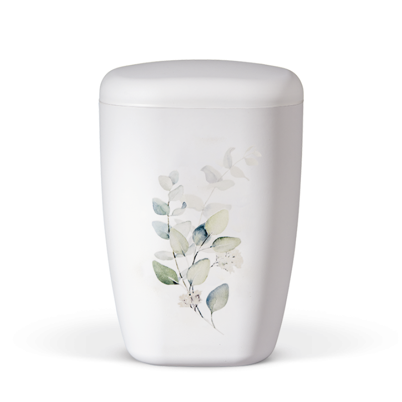 Die Naturstoffurne in Weiß Matt hat eine ovale Form und zeigt ein zartes Eucalyptus-Motiv in sanften Grüntönen auf der Vorderseite.