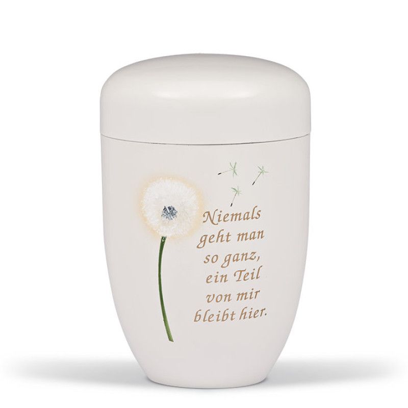 Stahlurne in cremeweiß mit Airbrush-Motiv einer Pusteblume und dem Trauertext „Niemand geht man so ganz, ein Teil von mir bleibt hier“ in goldener Schrift.