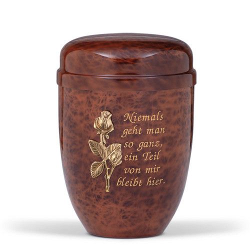 Die Stahlurne im Wurzelholzdesign ist braun, hat eine ovale Form und zeigt eine goldene Rose sowie einen eingravierten Text auf der Vorderseite.