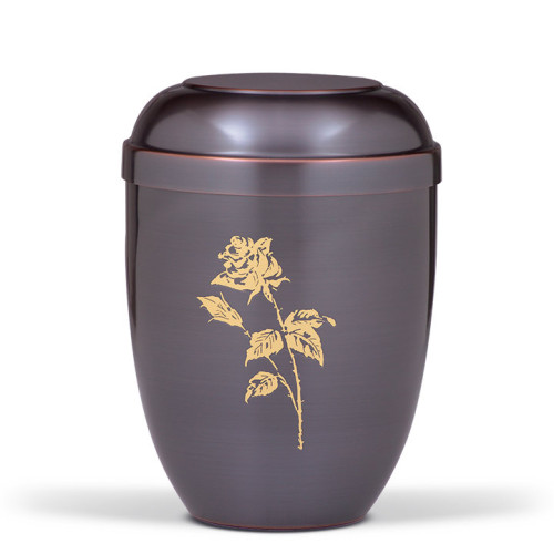 Die Urne-CUPATAN in Dunkelgrau hat eine runde Form, einen Deckel und ist mit einer goldenen Rosenmotivanbringung verziert.