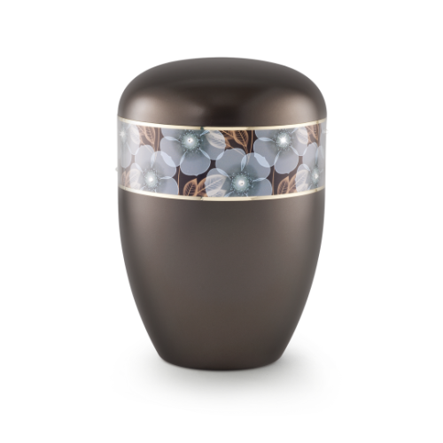 Die Urne der Edition Wave in perlmutt chocolat hat eine runde Form, ist aus einem matten Material gefertigt und zeigt ein Blumen-Dekor mit feinen Kristallen und Goldstreifen.