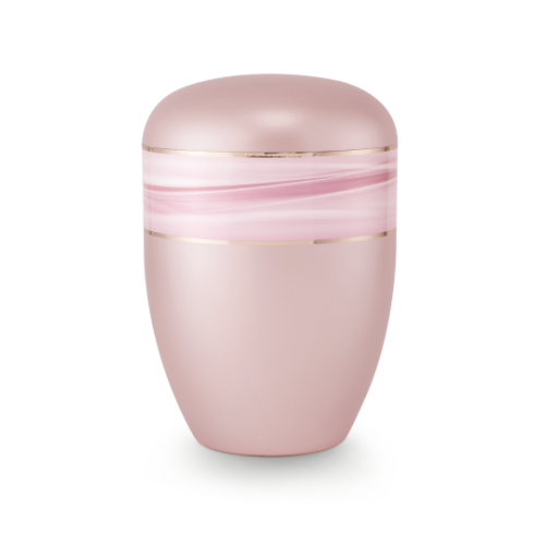Die Urne der Edition Wave in perlmutt rosé hat eine ovale Form, ist aus biologisch abbaubarem Material gefertigt und zeigt ein Wellenmotiv mit Goldstreifen.