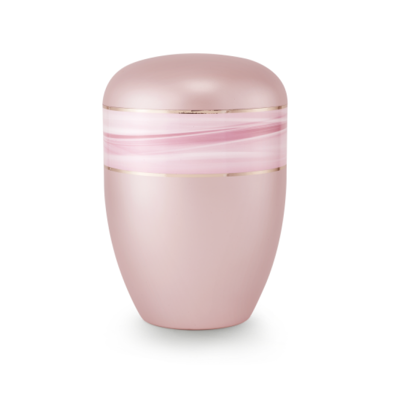 Die Urne der Edition Wave in perlmutt rosé hat eine ovale Form, ist aus biologisch abbaubarem Material gefertigt und zeigt ein Wellenmotiv mit Goldstreifen.