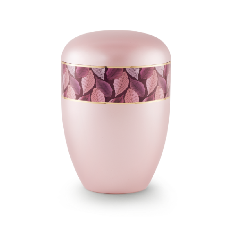 Die Urne der Edition Wave in perlmutt rosé hat eine ovale Form, ist mit einem Feuille-Zierband in Rosatönen und Goldstreifen verziert und bietet eine Gesamtansicht.