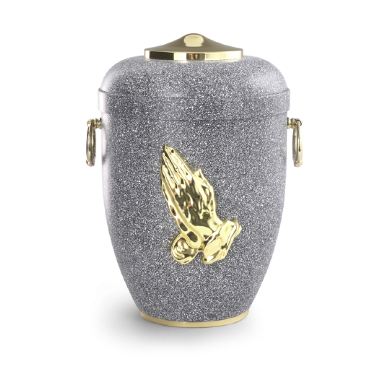 Urne aus basaltfarbenem, glitzerndem Material mit polierter Haube und Fuß, verziert mit goldenen betenden Händen, Gesamtansicht.