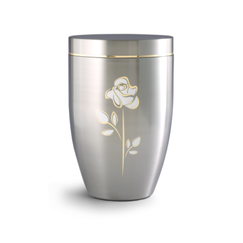 Die Urne der Edition Melina ist aus gebürstetem Edelstahl, hat eine schlanke Form, ist silberfarben und zeigt eine goldene Rose mit Stängel und Blättern.