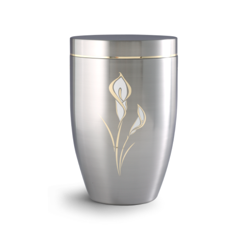 Die Metallurne der Edition Melina ist gebürstet, hat eine ovale Form und zeigt ein goldfarbenes Calla-Motiv auf silbernem Grund.