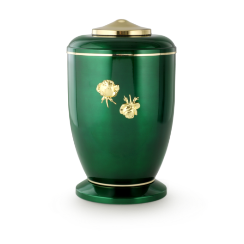 Die grün glänzende Urne aus Stahl hat eine polierte Oberfläche, goldene Verzierungen in Form von Röschen und eine runde, geschwungene Form mit einem Deckel.