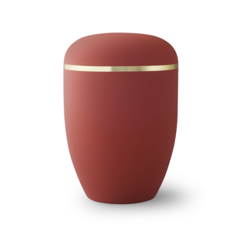 Die Urne der Edition Xenon in Samton rubin hat eine ovale Form, eine matte Oberfläche und ist mit einem gebürsteten Goldband verziert.