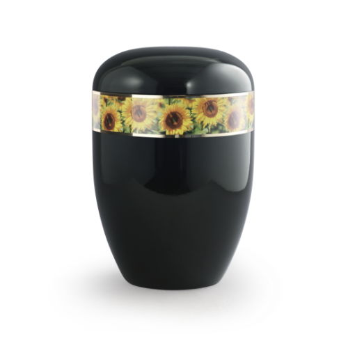 Die Urne aus der Edition 360° hat eine ovale Form, ist in glänzendem Schwarz gehalten und verfügt über einen dekorativen Streifen mit Sonnenblumenmotiven.