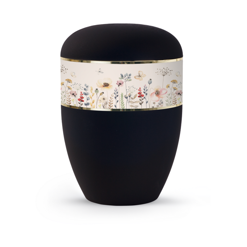 Die Urne aus der Edition Memorius ist in tiefschwarz gehalten, mit einem Blumen-Aquarellband und goldfarbener Verzierung, in Gesamtansicht.