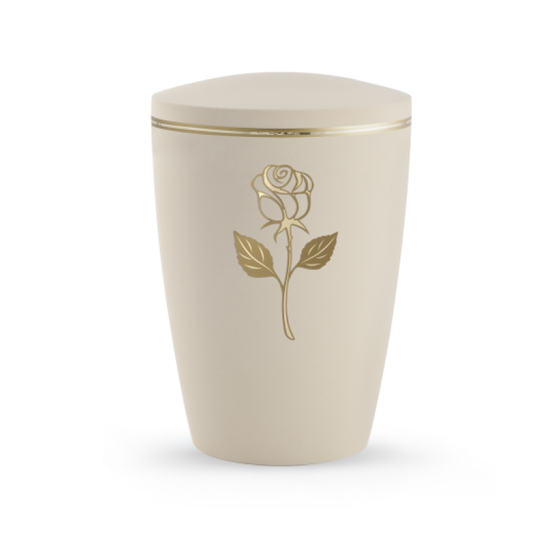 Die Urne in Samtton Creme hat eine ovale Form, ist aus biologisch abbaubarem Material gefertigt und zeigt eine goldene Rose mit Blättern auf der Vorderseite.