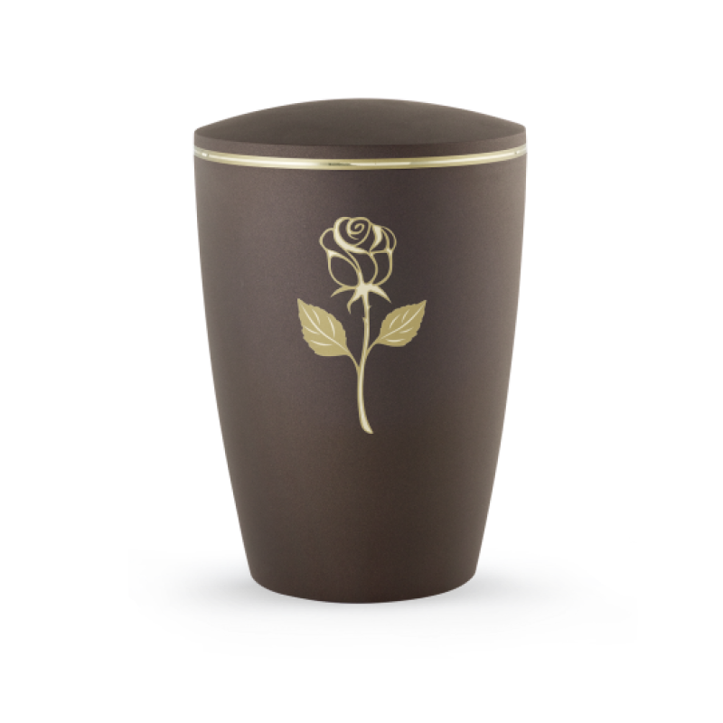 Die Urne in Samtton Cafe hat eine ovale Form, ist aus biologisch abbaubarem Material gefertigt und zeigt eine goldene Rosenapplikation sowie einen matt/glänzenden Rand.