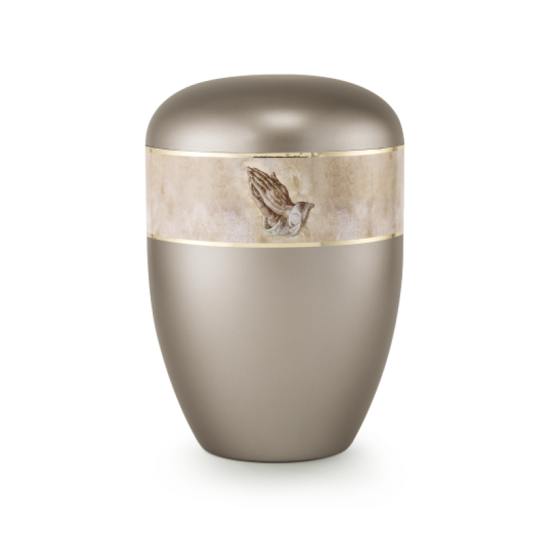 Die Urne aus der Edition 360° ist in perlmutt fumé gehalten, hat eine ovale Form und zeigt ein dekoratives Band mit einem Vogelmotiv sowie goldenen Akzenten.