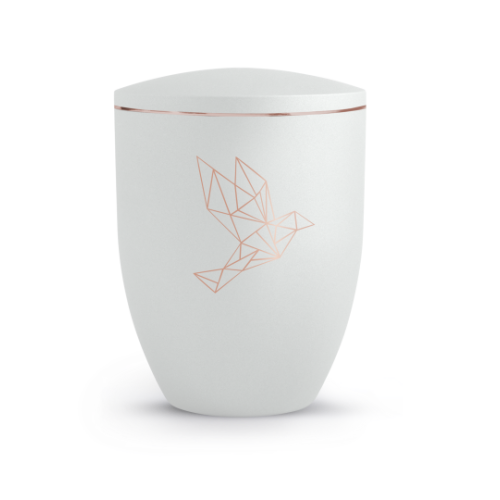 Die Urne der Edition Geometric ist aus weißem Material gefertigt, hat eine ovale Form und zeigt ein kupferfarbenes, geometrisches Taubenmotiv.