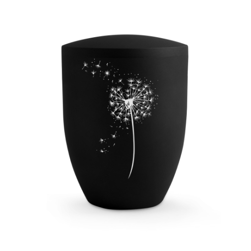 Die Urne aus der Edition Karat ist tiefschwarz, hat eine ovale Form und zeigt eine Pusteblume mit hochwertigen Kristallen besetzt, in Gesamtansicht.