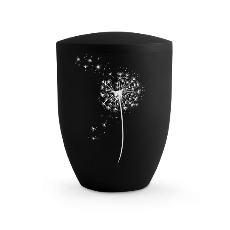 Die Urne aus der Edition Karat ist tiefschwarz, hat eine ovale Form und zeigt eine Pusteblume mit hochwertigen Kristallen besetzt, in Gesamtansicht.
