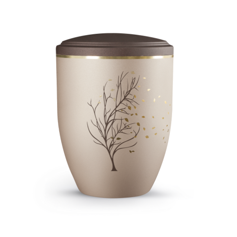 Die Urne der Edition La Vida ist champagnerfarben mit einer goldenen Baum- und Blättergrafik, hat eine runde Form und einen braunen Deckel.