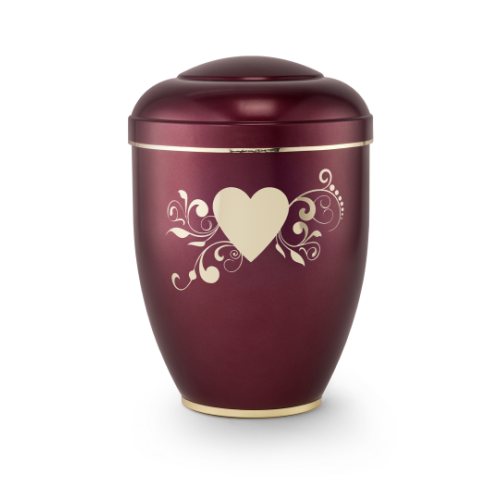 Die Urne aus der Edition Creatio ist weinrot mit einer polierten Oberfläche, einem Herzmotiv und floralen Verzierungen in Cremefarbe, mit einem abgerundeten Deckel.