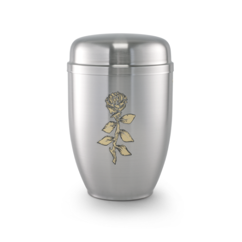 Die Urne Cestal von Goetz ist satiniert, in Silber gehalten und zeigt eine goldene Rose als Dekor, mit einer ovalen Form und einem abgerundeten Deckel.