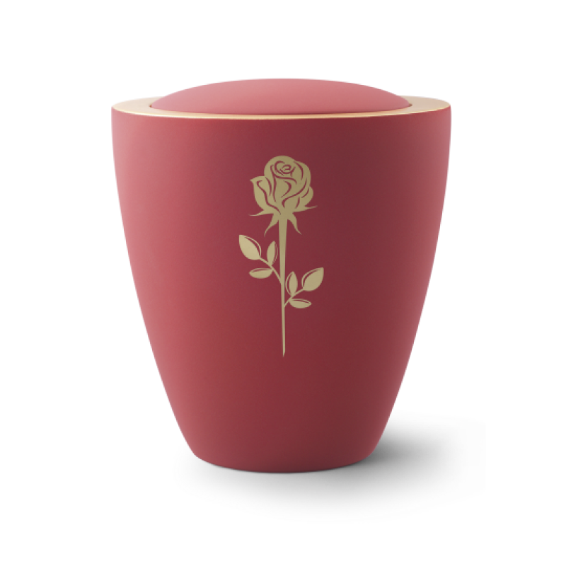Die Urne aus der Edition Colour Line ist in Samton rubin gehalten, hat eine goldene Messingrose und eine ovale Form mit einem abgerundeten Deckel.