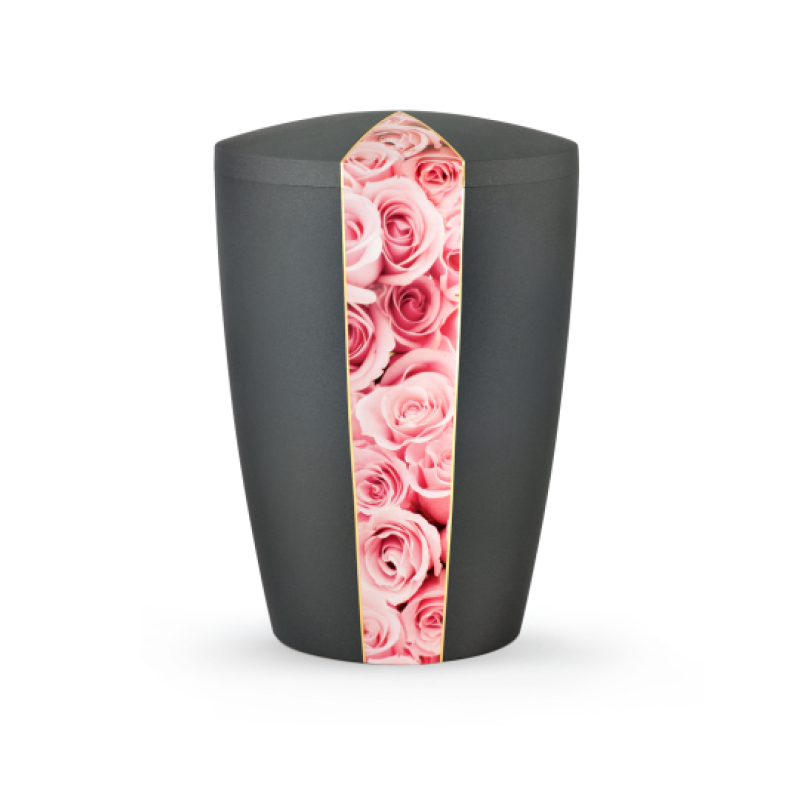 Die anthrazitfarbene Urne aus der Edition Natura hat eine ovale Form und ist mit einer dekorativen Banderole aus rosa Rosen verziert.
