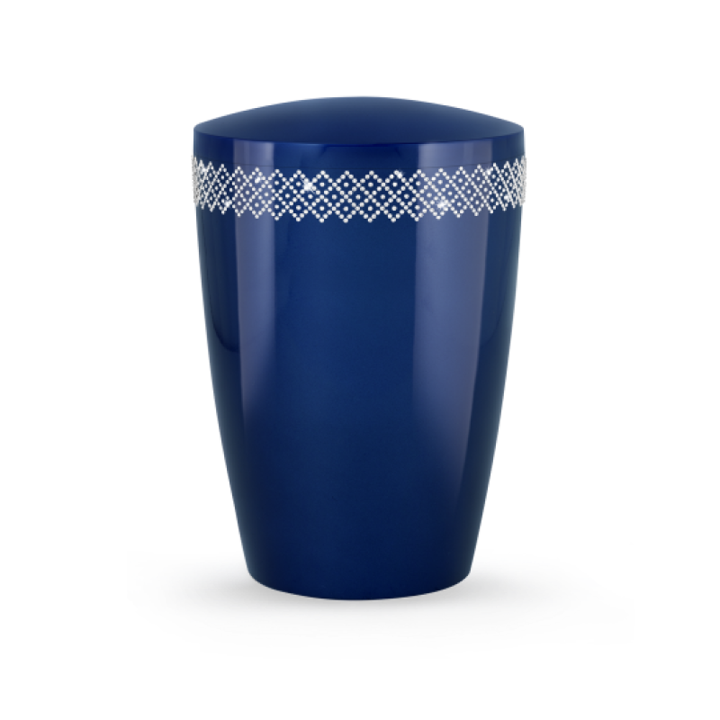Die Urne aus der Edition Karat ist hochglanz in königsblau mit einem Kristall-Musterband und hat eine ovale Form.