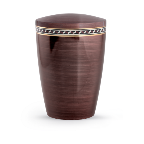 Eine kastanienbraune Urne mit Zacken-Muster, aus biologisch abbaubarem Material, in zylindrischer Form und mit abgerundetem Deckel, Gesamtansicht.