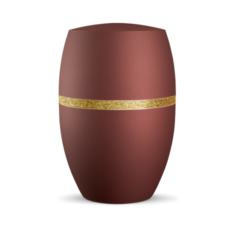 Die Urne in Rubinrot hat eine ovale Form, eine matte Oberfläche und ist mit einem gold glitzernden Dekorstreifen verziert.