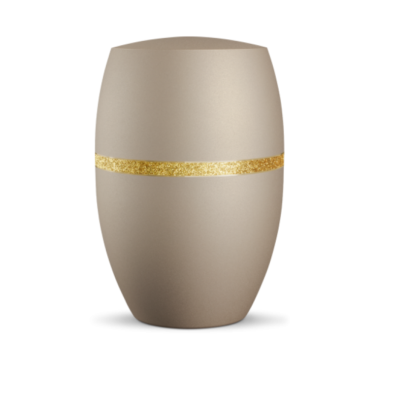 Die Urne in velvet Champagner hat eine ovale Form, ist gold glitzernd dekoriert und zeigt einen goldenen Streifen in der Mitte.