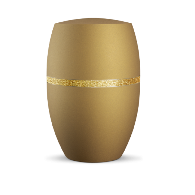 Die Urne in Goldocker hat eine ovale Form, eine matte Oberfläche und ist mit einem glitzernden goldenen Dekorstreifen verziert.
