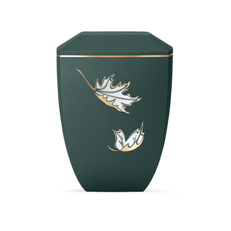 Die Urne der Edition Facette in Velvet Petrol hat eine sechseckige Form, ist aus biologisch abbaubarem Material gefertigt und zeigt goldene Blätter als Dekor.