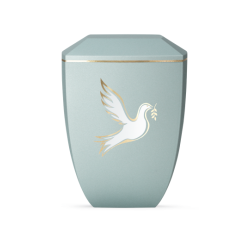 Die Urne der Edition Facette in Velvet Eisblau hat eine sechseckige Form, ist aus biologisch abbaubarem Material und zeigt eine weiße Taube mit goldenen Akzenten.