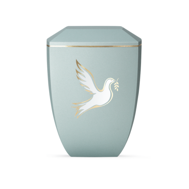 Die Urne der Edition Facette in Velvet Eisblau hat eine sechseckige Form, ist aus biologisch abbaubarem Material und zeigt eine weiße Taube mit goldenen Akzenten.