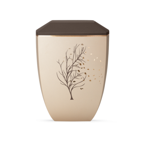 Die Urne der Edition Facette in Velvet Champagner/Siena hat eine ovale Form, eine braune Deckeloberfläche und zeigt ein filigranes Baum-Motiv in goldenen Tönen.
