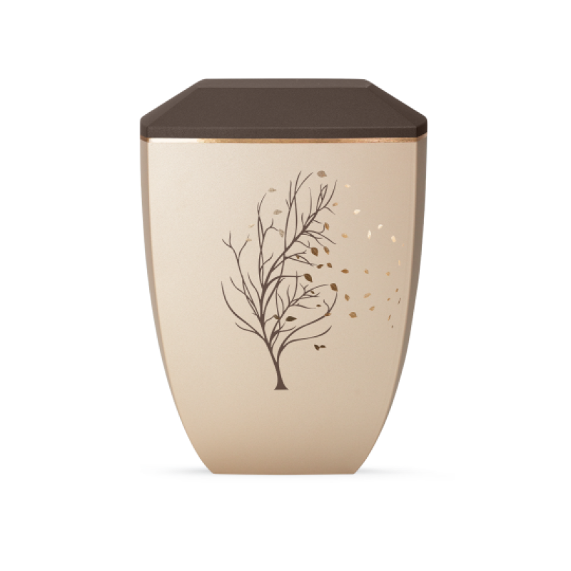 Die Urne der Edition Facette in Velvet Champagner/Siena hat eine ovale Form, eine braune Deckeloberfläche und zeigt ein filigranes Baum-Motiv in goldenen Tönen.