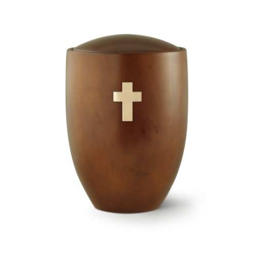 Die Urne aus der Edition Sevilla besteht aus Erle und Teakholz, hat eine ovale Form und ist mit einem gebürsteten Messingkreuz in der Mitte verziert.
