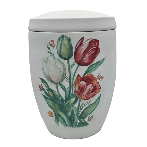 Die Alto Urne ist oval, in Weiß gehalten und zeigt eine farbenfrohe Tulpenmotivik in Rot, Pink und Grün auf der Vorderseite.
