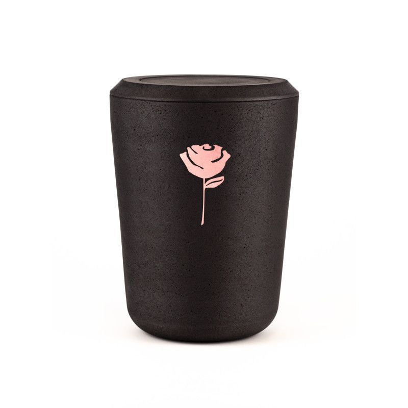 Kohleurne in schwarzem Material mit einer roséfarbenen Rose als Dekor, in zylindrischer Form und mit einem abnehmbaren Deckel.